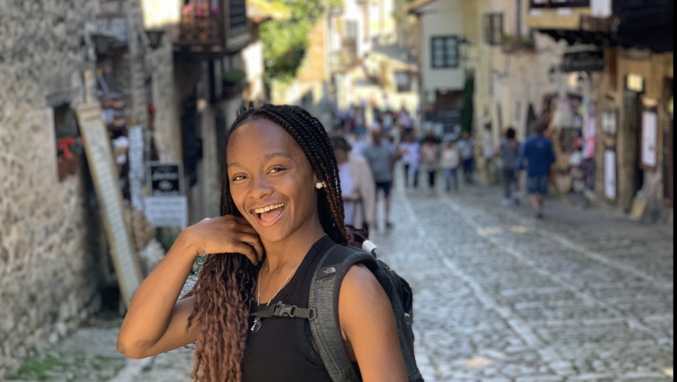 Toinette smiling in streets of Spain