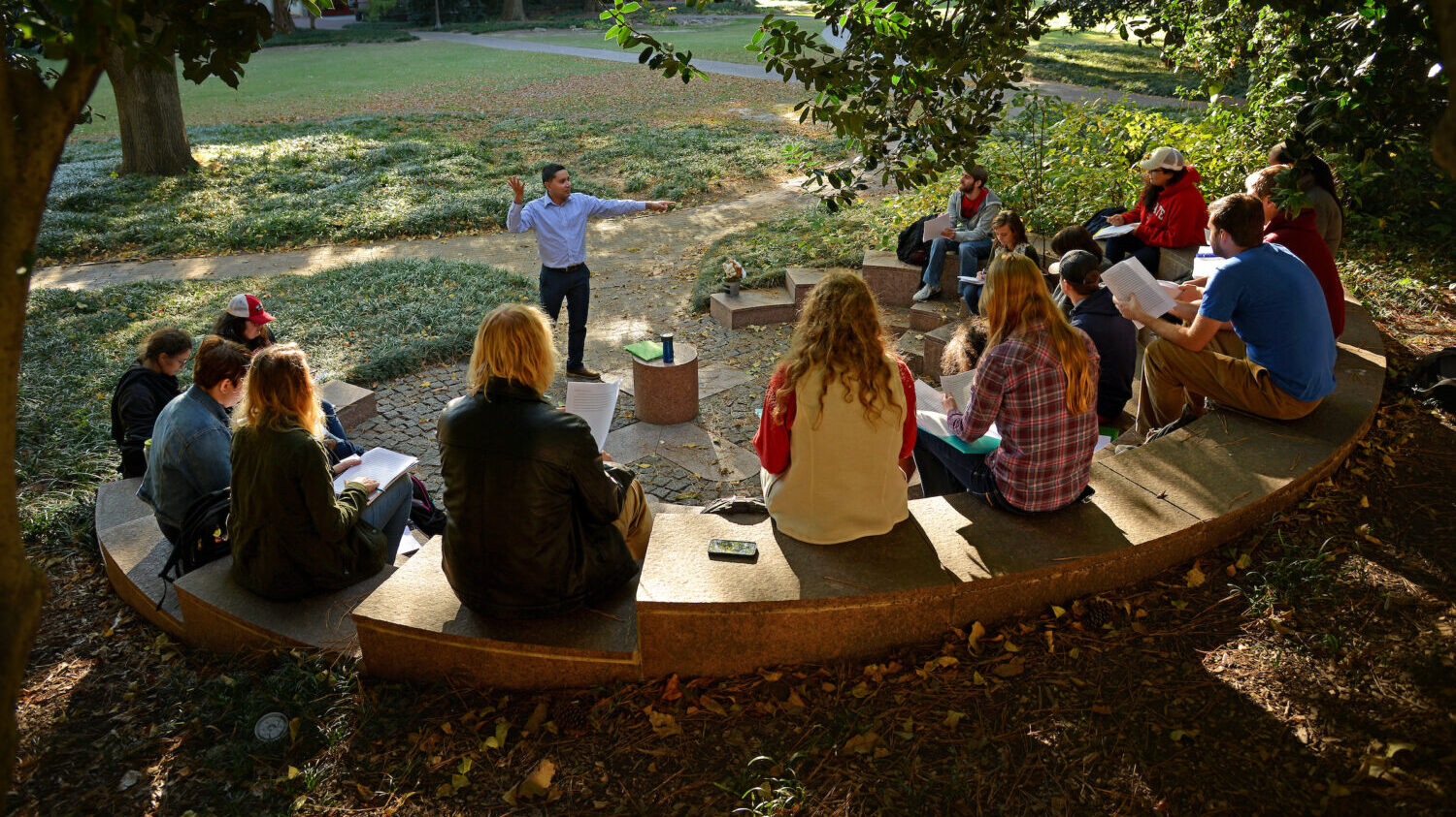 A professor addresses students on the Court of North Carolina